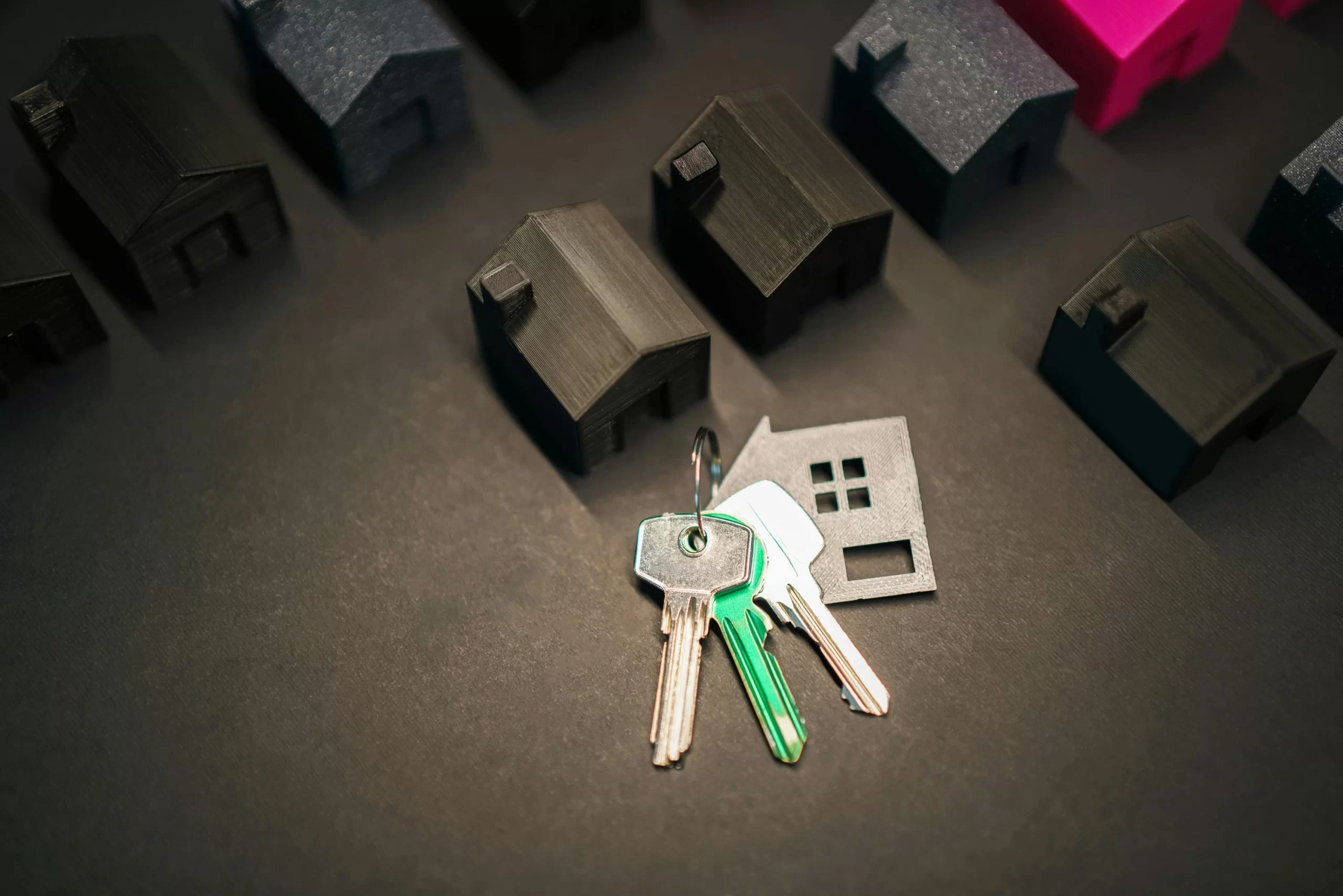 A group of keys in front of a house, symbolizing FHA Loan West Palm Beach FL opportunities.