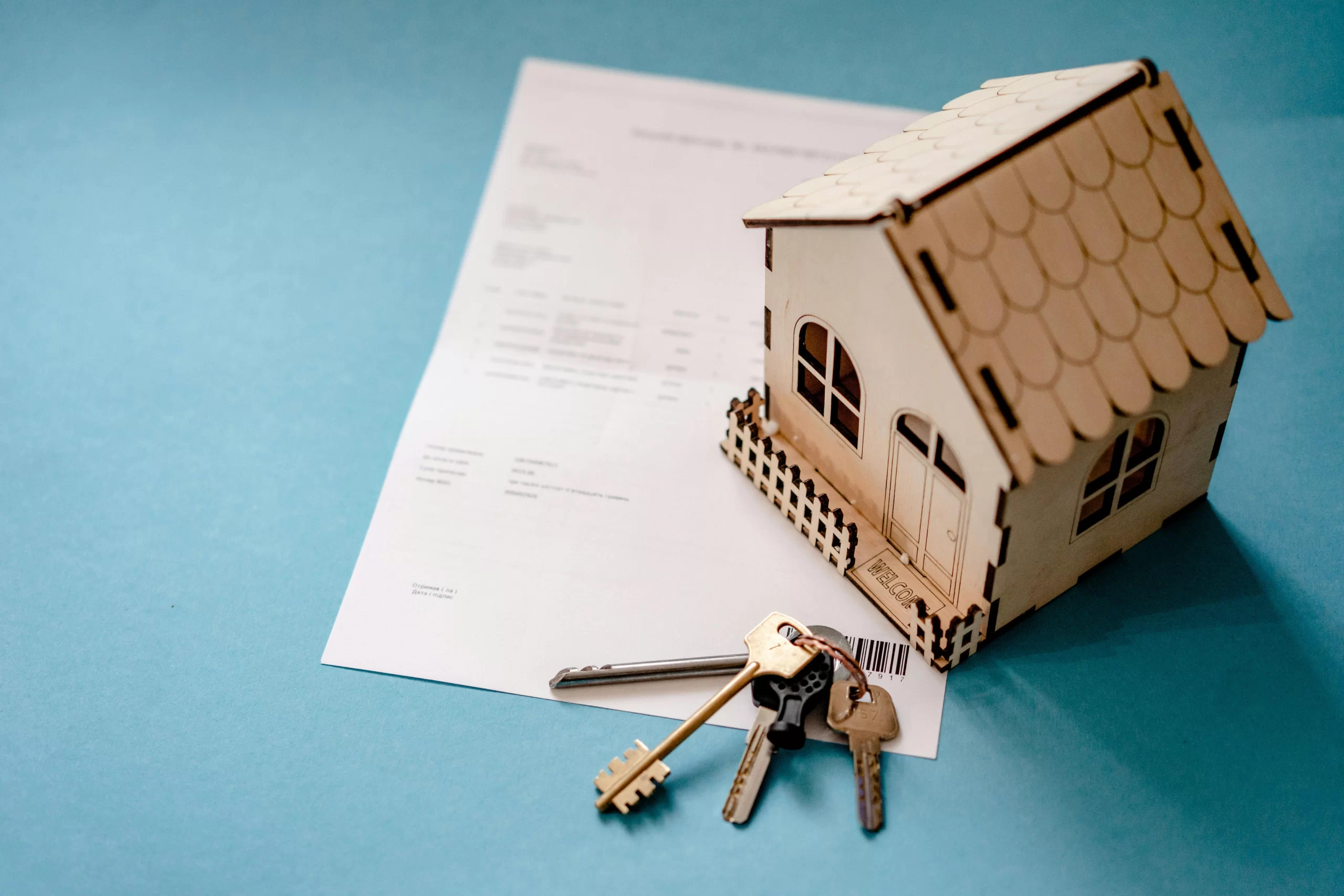 House model with keys and paper, representing FHA Loan Port St Lucie FL.